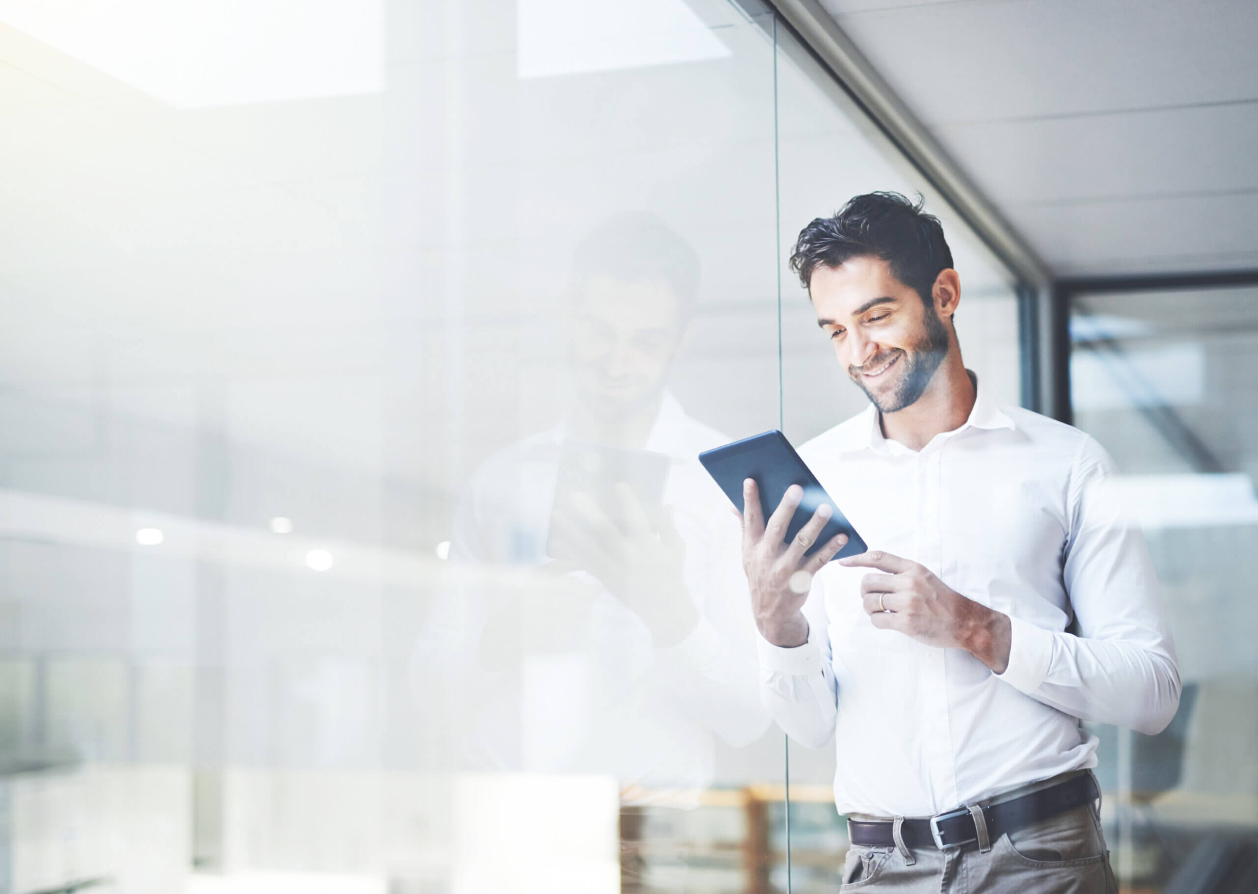 Technology man looking at ipad window scaled